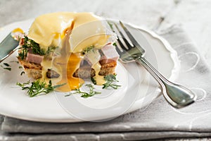 Eggs Benedict in the context of a hollandaise sauce