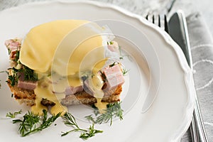 Eggs Benedict in the context of a hollandaise sauce