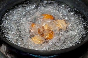 Eggs in boiling water.