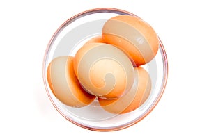 Eggs into the bowl from above