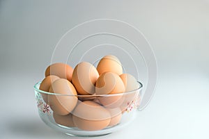 Eggs in a bowl on a white background.