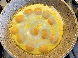 Eggs in butter, yolks close-up, isolated on white background.