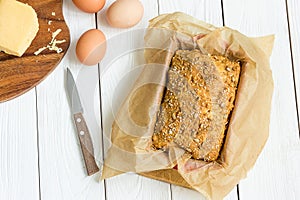Eggs, Cheese and Homemade Gluten Free Butter Bread, Brioche, in the Baking Dish on a Light White Wooden Background, Close-up, Hori