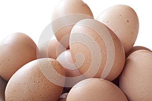 Eggs cooking for breakfast, a protein form yolk and albumen on a white background, or on a plain wooden table.