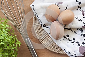 Eggs cooking for breakfast, a protein form yolk and albumen on a white background, or on a plain wooden table.