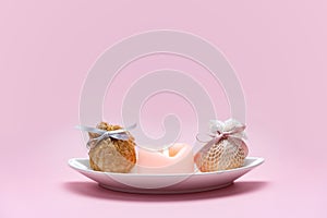 Eggs decorated with ribbons on a plate. Easter background