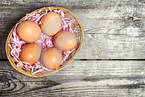 Eggs on decorative straw in a basket