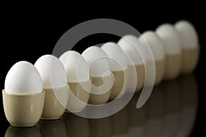 Eggs in egg-cups in a row
