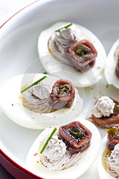 eggs filled with anchoa spread with anchoa on the top photo