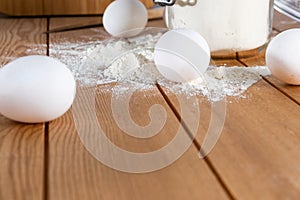 Eggs and Flour Jar on wooden surface