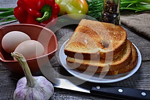 eggs and fresh vegetables, red peppers, garlic, tomatoes, fried toasters