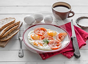 Eggs fried overeasy served on white plate