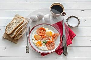 Eggs fried overeasy served on white plate