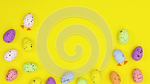 Eggs for Happy Easter appear on yellow theme leaving space for text. Stop motion
