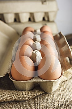 Eggs in paper pack on sack cloth