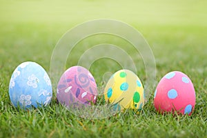 Eggs pastel on grass background in ester day