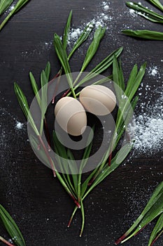 Eggs and Ramson on a black table, wood garlic and flour