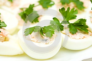 Eggs stuffed with red fish on plate