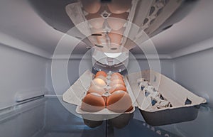 Eggs in tray inside refrigerator fridge