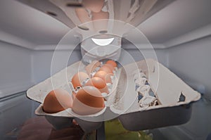 Eggs in tray inside refrigerator fridge