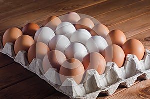Eggs in a tray on a wooden table