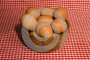 eggs in wooden boul, fresh colored eggs photo