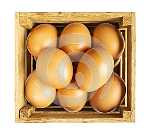 Eggs in wooden box isolated on white background. Bird eggs isolated. Close-up of an eggs on white. Chicken eggs