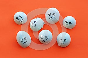 Eggshells with painted faces with different emotions