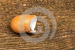 Eggshells on a wooden background. Good to use in compost
