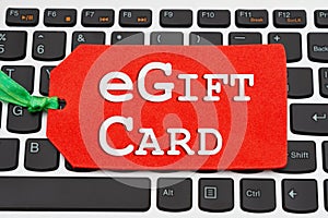 EGift Card message on red gift tag on keyboard