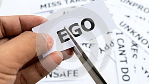 Ego ego ntext or word meaning on paper in hand holding.