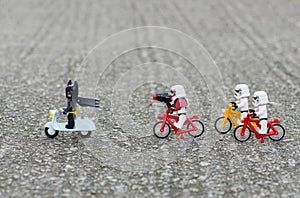 Ego starwars troopers riding bicycle chasing lego batman