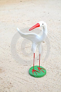 Egret model standing on the sand