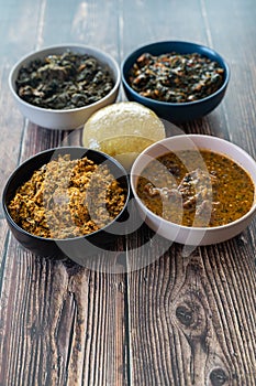 Egusi Ogbonno, Vegetable and Afang soup with pounded yam and Eba Garri