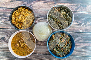 Egusi Ogbonno, Vegetable and Afang soup with pounded yam photo