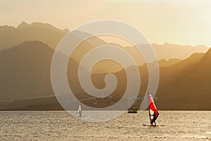 Egypt. Dahab. Windsurfing at sunset photo