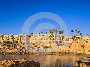 Egypt, Hurghada- AUGUST 28th 2020 Crystal clear azure water - resort with white beach - paradise coastline, beautiful buildings