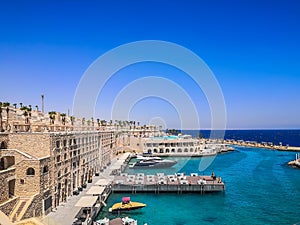 Egypt, Hurghada- AUGUST 28th 2020 Crystal clear azure water - resort with white beach - paradise coastline, beautiful buildings