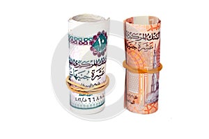 Egypt money roll of new first Egyptian 10 LE EGP ten pounds plastic polymer banknote and the old paper note isolated on white