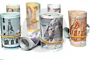 Egypt money roll pounds banknotes isolated on white background, Egyptian pounds cash money bills rolled up with rubber bands