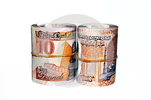 Egypt money rolls of new first Egyptian 10 LE EGP ten pounds plastic polymer banknote isolated on white background