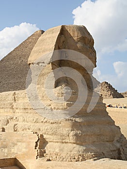 Egypt. The Sphinx (side view) and the pyramid of Cheops.