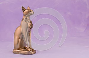 Egyptian cat Bast or Bastet, solar and war goddess, isolated on pink  background