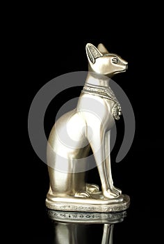 Egyptian cat statue isolated on black background