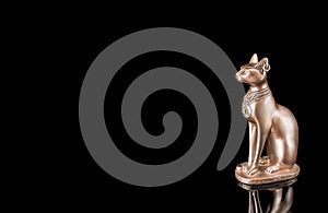 Egyptian cat statue isolated on black background