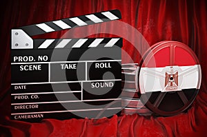 Egyptian cinematography, film industry, cinema in Egypt. Clapperboard with and film reels on the red fabric, 3D rendering