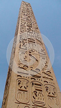 Egyptian column against blue sky