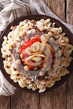 Egyptian Cuisine: kushari close-up on the plate. Vertical top vi