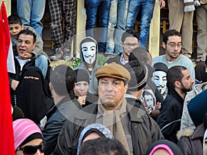 Egyptian demonstrators wearing masks