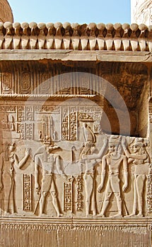 Egyptian engraved gods on wall